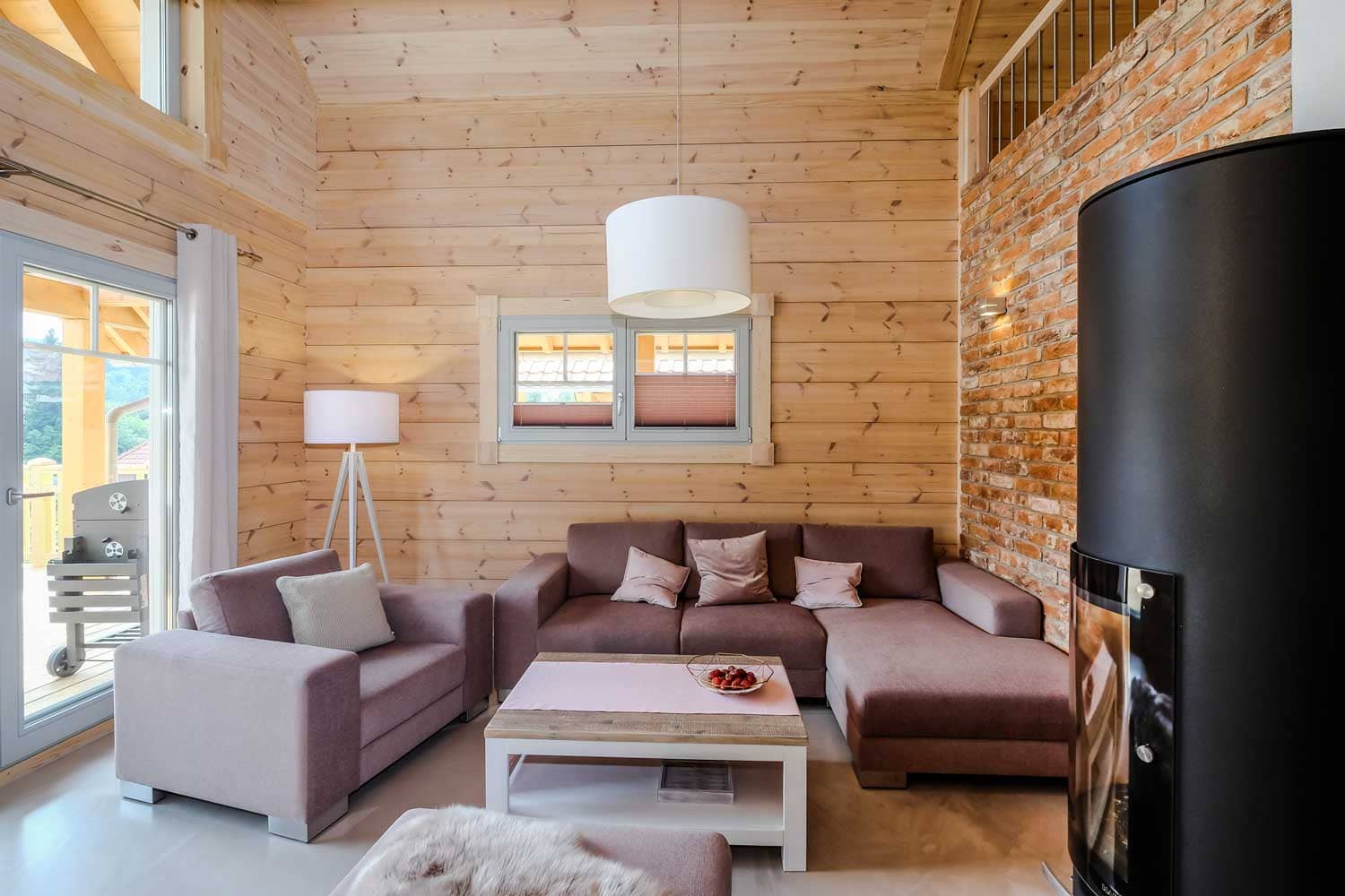 Lodge Blickfang – Wohnbereich mit Kaminofen